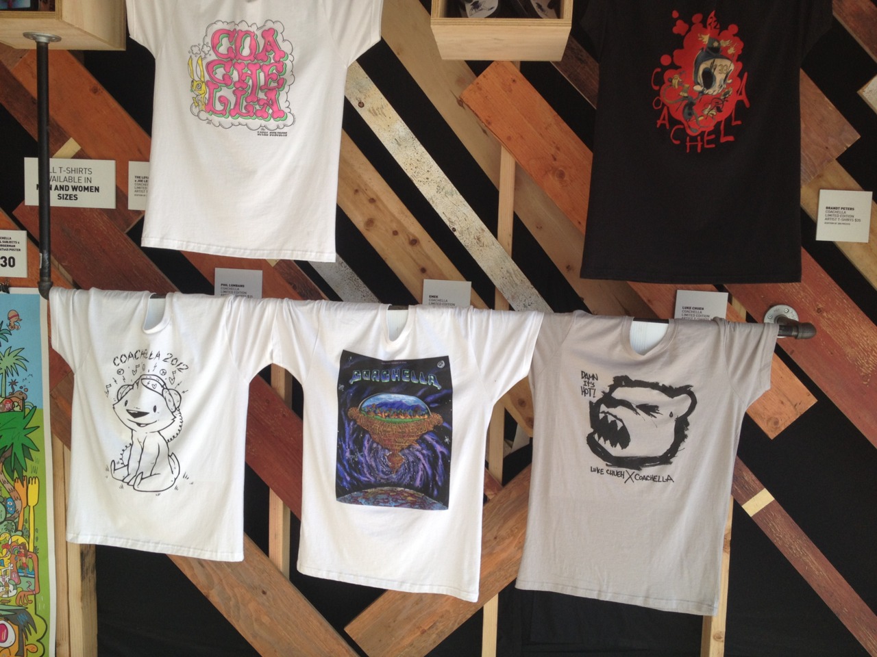 The angel fountain at the Empire Polo Club — festivalgoers resting beneath palms, the fountain at center