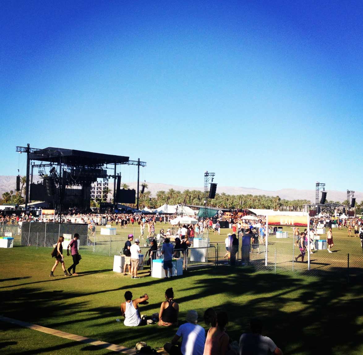 The VIP Rose Garden at Empire Polo Club — roses in full bloom, palm trees, desert sky