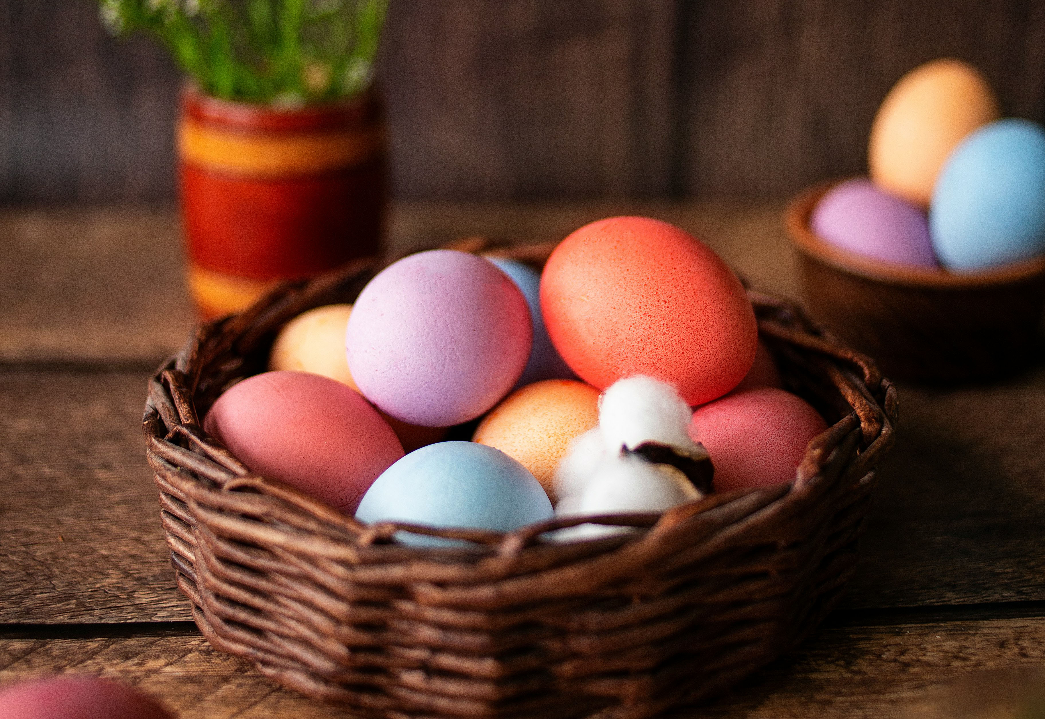 Easter eggs in a basket in a green field